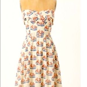 And orange and blue bicycle dress